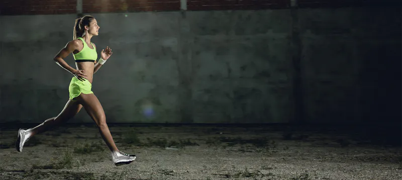 athlete running with foot overlay visualized