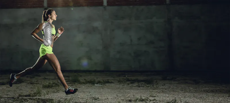 athlete running with spine overlay visualized